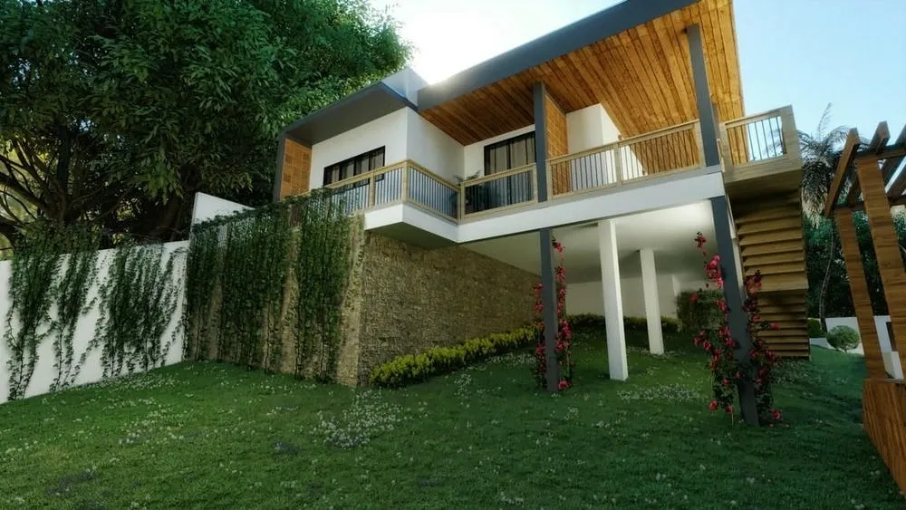 Interior de sala de estar en casa de campo, con chimenea, sofás cómodos y vista al exterior.