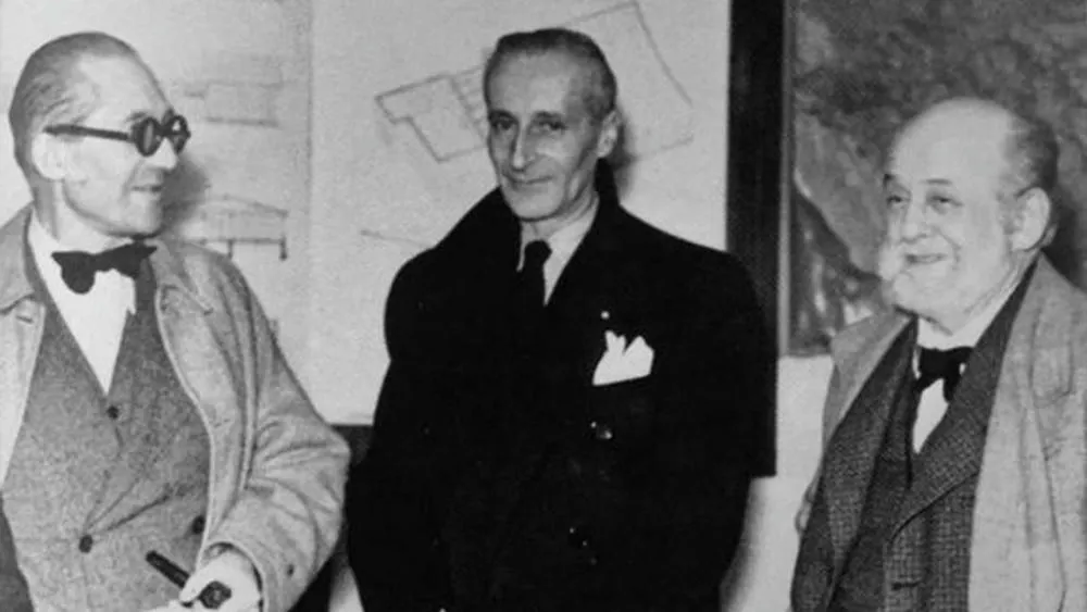 Black and white photograph of Le Corbusier and Auguste Perret, important figures of modernist architecture who influenced brutalism.
