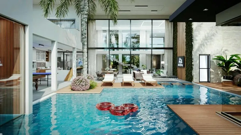 Leisure area of a luxury two-story house with pool, lounge chairs, and lush garden, connected to the living room.
