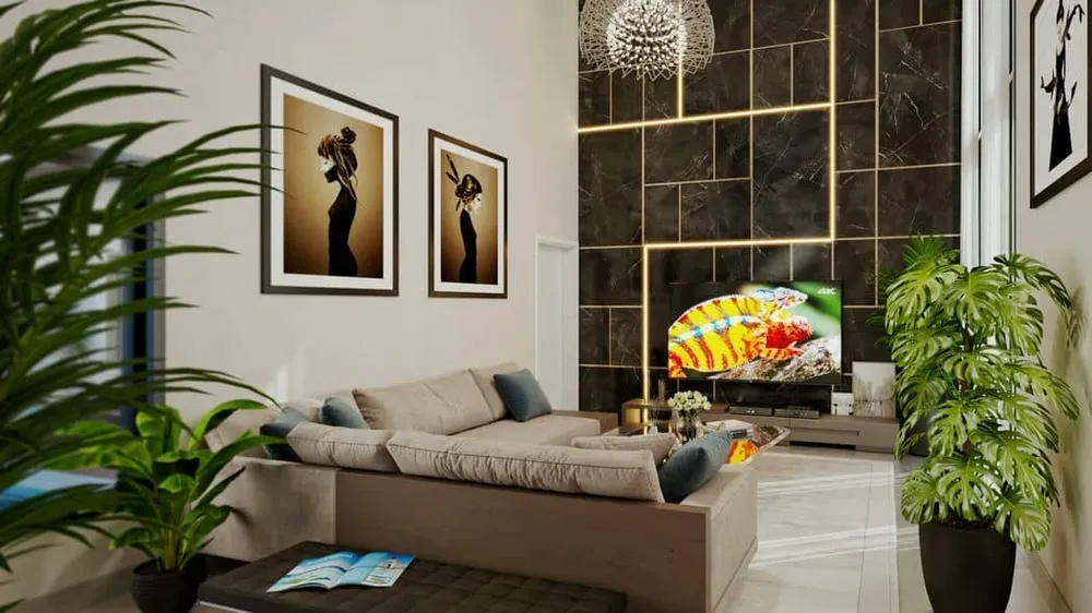 Living room with illuminated dark marble TV panel, plants, and sofa, highlighting accent lighting and modern cladding.