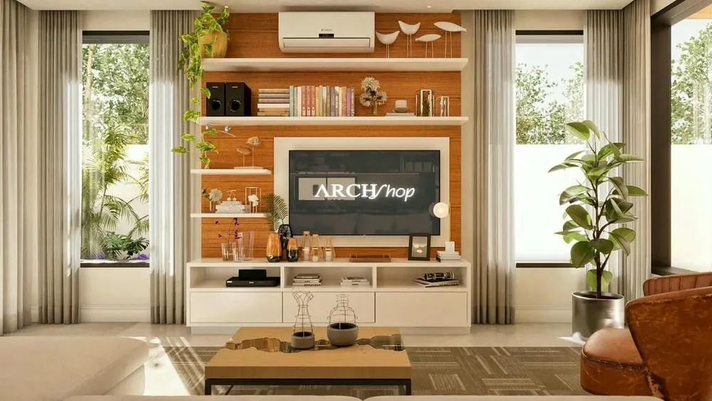 Living room illuminated by large windows with light curtains, featuring a wooden panel with white shelves, a television, and decorative plants that bring life to the environment.