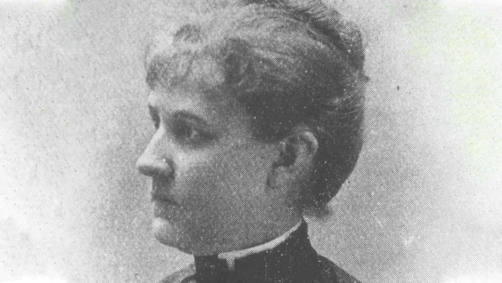 Black and white portrait of Louise Blanchard Bethune, wearing a hat, representing a pioneering architect.