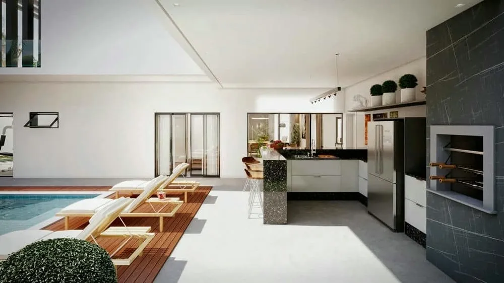 Modern gourmet area with barbecue and integrated counter to the leisure area, ideal for socializing.