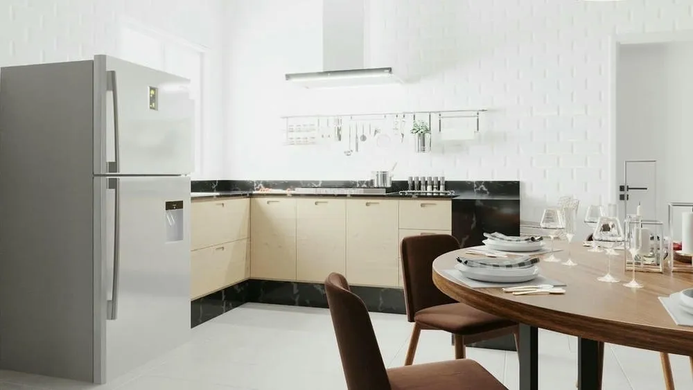Open plan kitchen with island and dining table nearby, facilitating social interaction during meal preparation.