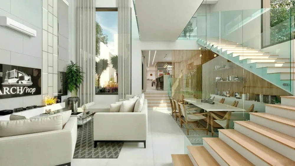 Sala de estar y comedor integradas con doble altura, escalera de vidrio y grandes ventanas, mostrando espacios multifuncionales y conexión con el exterior.