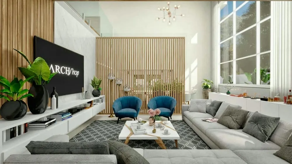 Sala de estar con sofá grande, sillones azules, panel de madera laminado y techo alto, ilustrando la mezcla de estilos con elementos de madera.
