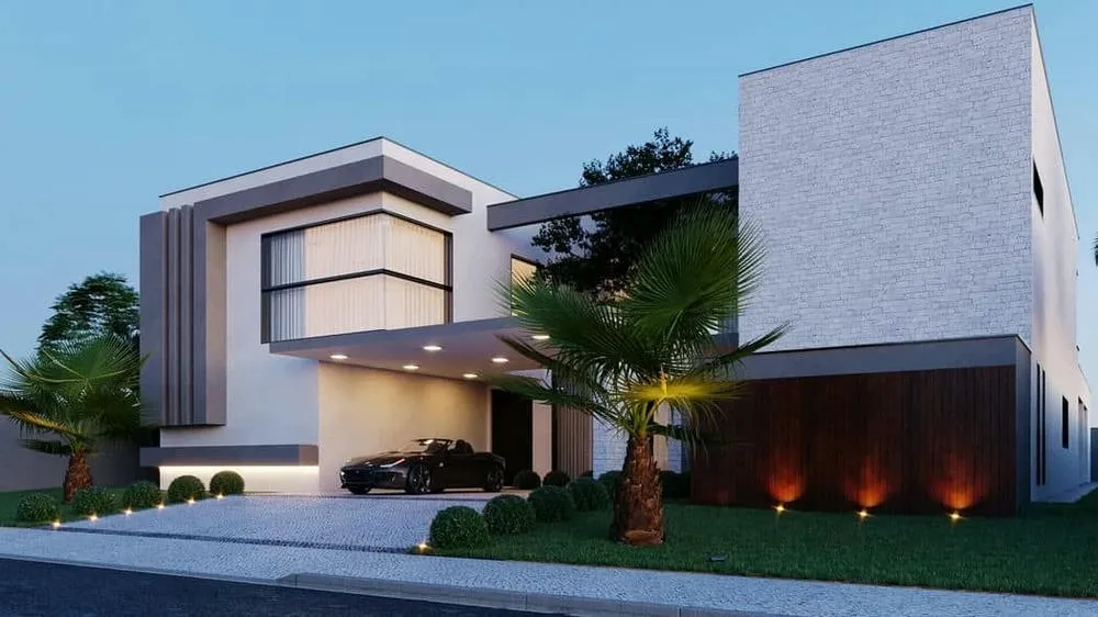 Side facade of a luxury house with wooden details, lighting, and palm garden.
