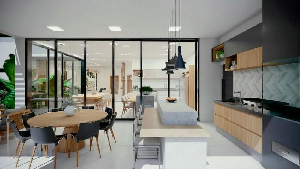 Contemporary single-story house with spacious gourmet area and direct connection to the living room, promoting integration.
