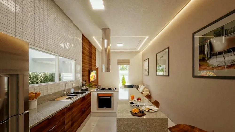 Compact and functional kitchen with countertop, built-in stove and dining table, optimizing space.