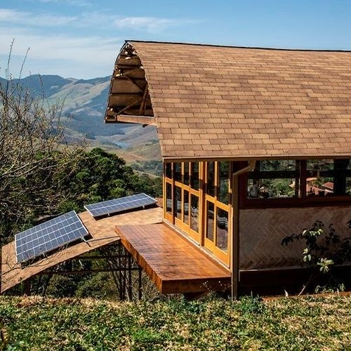 Representation of sustainable architecture with green elements and technology.