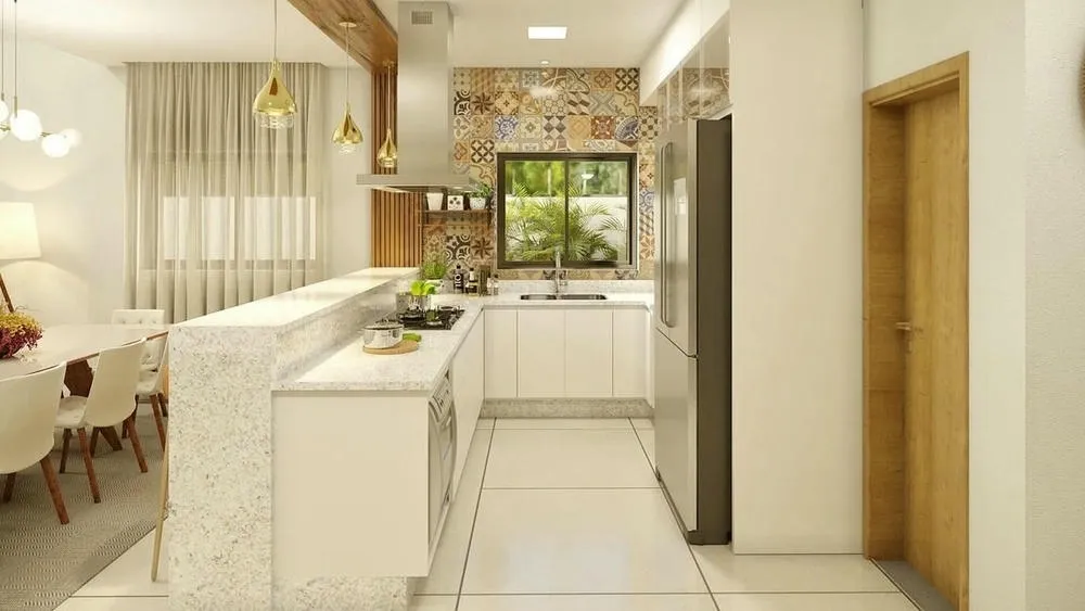 U-shaped kitchen with space for multiple cooks, demonstrating functionality for simultaneous activities.